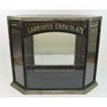 A rare Victorian Cadbury's Chocolate, Makers to the Queen ebonised octagonal display cabinet, with