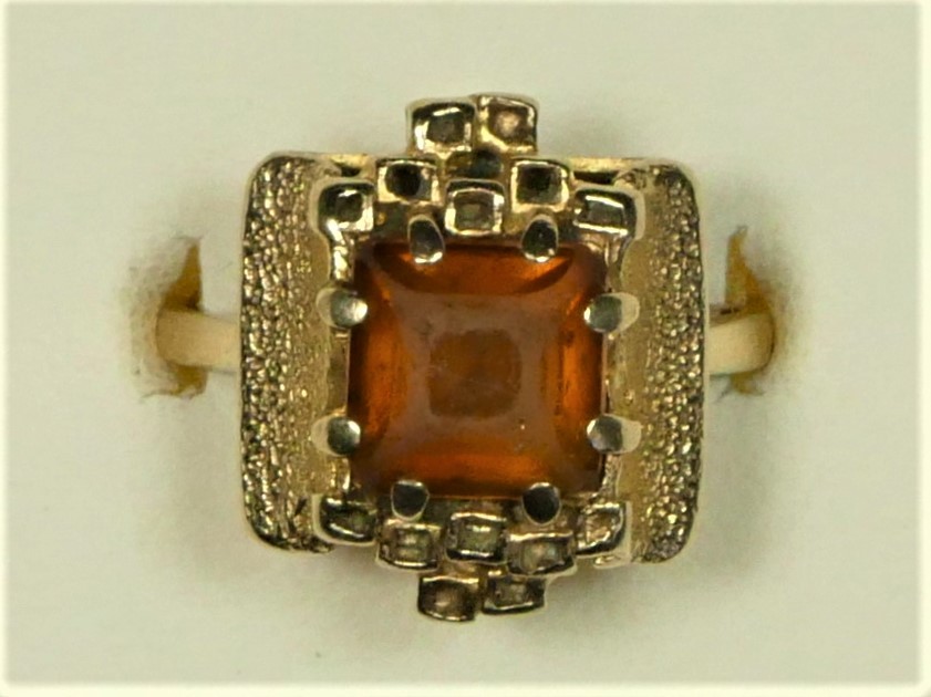 A 9ct gold citrine Modernist dress ring, by CS, London 1973, the square cut stone in an abstract