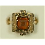 A 9ct gold citrine Modernist dress ring, by CS, London 1973, the square cut stone in an abstract