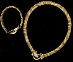 A 14K gold, diamond and onyx basket weave necklace, the stirrup clasp set with brilliant cut