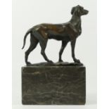 After L. Carvin - A bronze study of a dog, on a marble plinth, signed L. Carvin. 19cm tall.