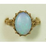 A 9ct gold dark opal and diamond dress ring, 19 x 10mm, ornate mount, P 1/2, 4.8gm