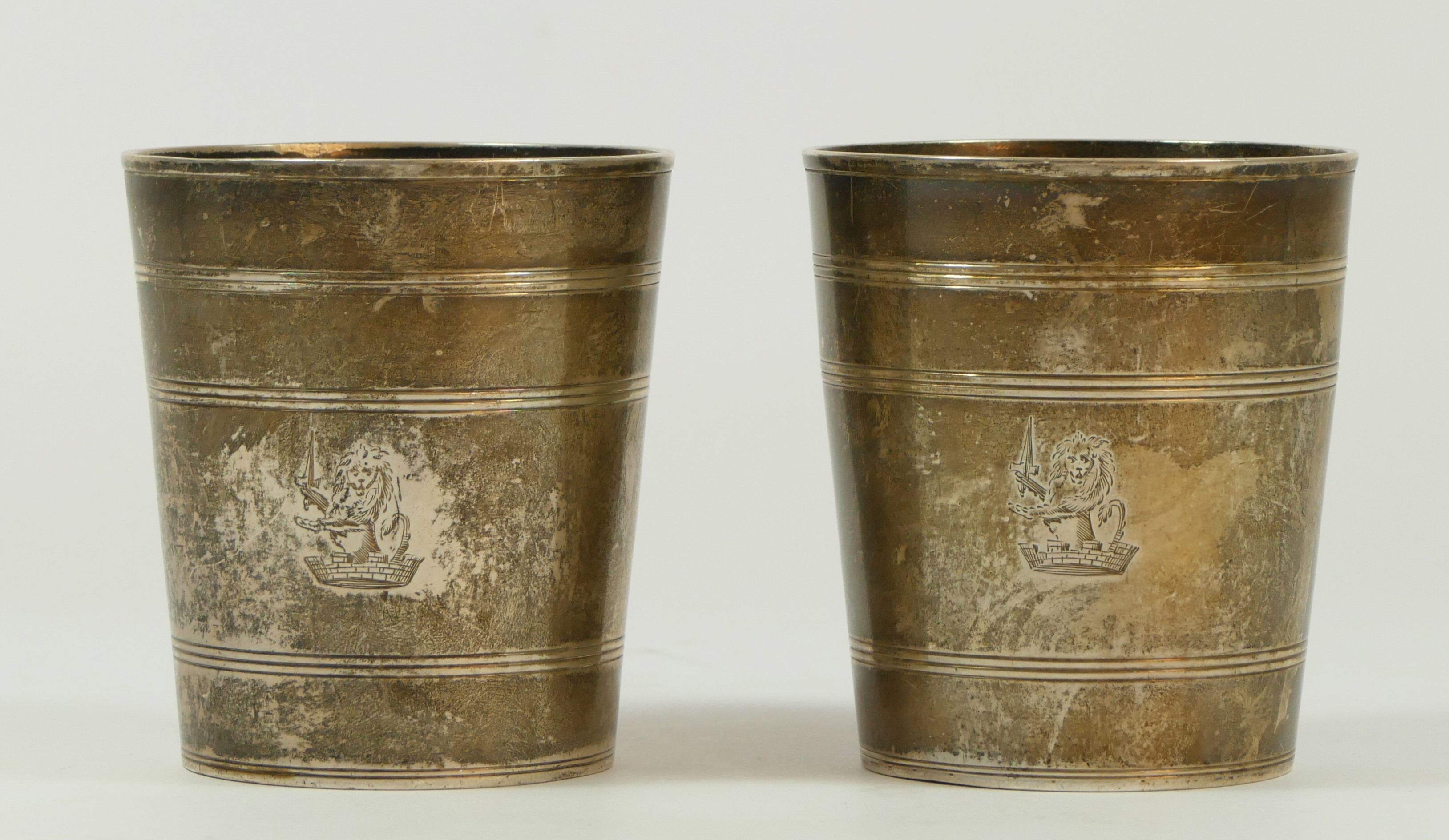 A George III silver pair of tapering beakers, by John Eames, London 1818, with line engraved