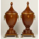 A pair of George III style mahogany vase shape tea caddies, with boxwood and ebony inlay, lion