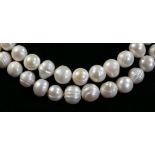 A freshwater pearl necklace of Opera length, beads 8 - 10mm, 155cm