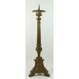 A 19th century church altar pricket candlestick, impressed panels depicting Jesus, Mary and Sacred