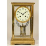 A 19th Century French brass four glass and gilt metal eight day mantel clock, with plain case,