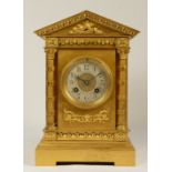 Martie et Cie, Paris, a late 19th century French gilt brass mantel clock, silvered chapter ring,