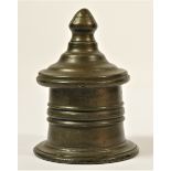 An early 19th century lead tobacco jar, of circular form with a spreading foot, knop finial to the