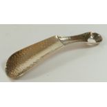 A Scottish Edwardian silver shoe horn, by Brook & Son, Edinburgh 1907, with spot hammered finish,