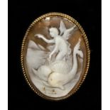 A gold mounted shell cameo, carved to depict Arion riding a dolphin, 43 x 33mm. This subject is