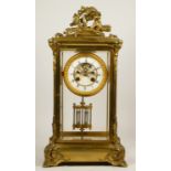 Samuel Marti et Cie, Paris, a late 19th century brass four glass mantel clock, the white enamel