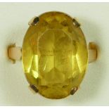 A 9ct gold citrine ring, Birmingham 1968, claw set with an oval mixed cut stone, 18 x 14mm, R, 6.5gm