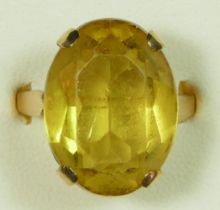 A 9ct gold citrine ring, Birmingham 1968, claw set with an oval mixed cut stone, 18 x 14mm, R, 6.5gm
