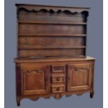 A good 18th century French ok dresser, believed Nancy/Metz region, with a three shelf rack with