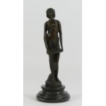 A bronze figurine of a flapper girl holding a tray, on a stepped circular marble base. 19cm tall.