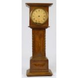 A late 19th Century oak miniature longcase clock, by X.L the movement by Hamburg American Clock