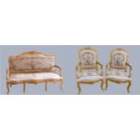 A Louis XV style giltwood and petite point embroidered salon suite, comprising three seat sofa