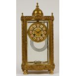 A 19th Century French brass four glass and gilt metal eight day mantel clock, with ornate cast