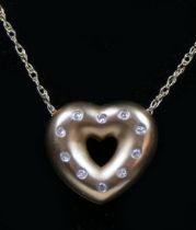 A 9ct gold openwork matt finish heart pendant, inset with ten diamonds, 15 x 14mm, chain, 3.1gm