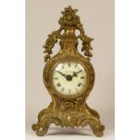 An Italian brass 8 day Louis XIV style mantel clock, with basket of flowers surmount, German Franz