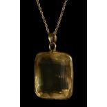 An unmarked gold mounted large citrine pendant, collet set with a mixed cut stone, 23 x 20 x 12mm,