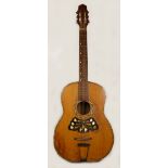A late 19th/early 20th century acoustic Continental guitar, with inset floral motif.