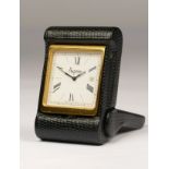 Asprey, a leather folding travel alarm with date quartz clock, model 2576, 6.5 x 4.5 x 1.5cm.