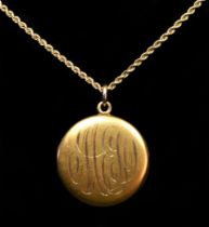 An American 14K gold circular locket, initialed, to a 14K gold chain, 13.3gm