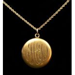 An American 14K gold circular locket, initialed, to a 14K gold chain, 13.3gm