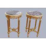 A pair of Louis XV style centre tables, giltwood with red veined moulded marble tops, above a