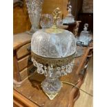 An assortment of crystal and cut glass vases, jugs, lamps, decanter sets and bowls to include Stuart