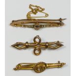 A Victorian 9ct gold flower and crescent bar brooch, Chester 1900, a rose gold scroll brooch and