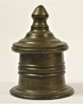 An early 19th century lead tobacco jar, of circular form with a spreading foot, knop finial to the