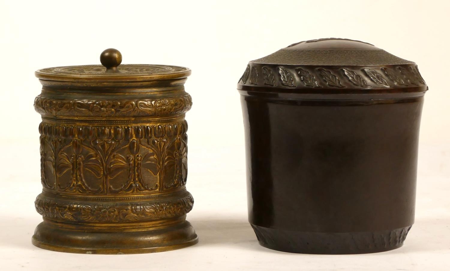 A Bakelite tobacco jar, with embossed leaf decoration, 11cm and an embossed brass example with