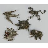 A silver swallow brooch, a silver and marcasite frog, tortoise and elephant brooch, and a silver and