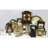 A collection of mid 20th Century and later mantel clocks, carriage clocks and wall clocks in four