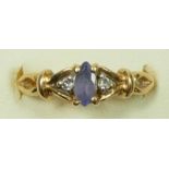 A 14ct gold tanzanite and diamond three stone ring, L, 2.6gm