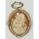 A late 19th century gold mounted shell cameo brooch, depicting a lady and cherub, 45 x 35cm, 11.2gm
