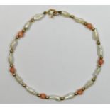 A 9ct gold bead, coral and rice pearl bracelet.