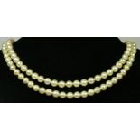 A two row uniform cultured pearl necklace, composed of 69 and 62 x 5mm beads, 9ct gold clasp.