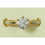 An 18ct gold and diamond cluster ring, stated weight 0.26ct, O, 2.8gm