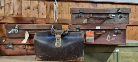 A gladstone bag, leather, with brass fittings, together with four leather suitcases (5)