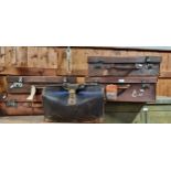 A gladstone bag, leather, with brass fittings, together with four leather suitcases (5)