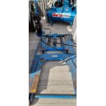 A hydraulic four arm car ramp, with pump, in recent use, for sale due to closure of business