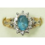 A 9ct gold blue topaz and diamond cluster ring, N 1/2, 2.6gm