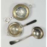 A silver Old English pattern sugar sifter, Sheffield 1918, and two tea strainers, Birmingham 1925