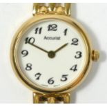 Accurist, a 9ct gold ladies wristwatch with integral bracelet, 20gm gross