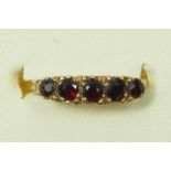 A 9ct gold and garnet five stone ring, N, 1.6gm