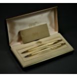 A Cross 1/20 18K gold plated biro and propelling pencil set, booklet and case